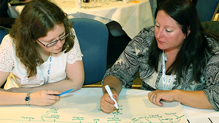 Two women in a conference workshop