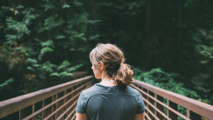 Woman standing on a bridge