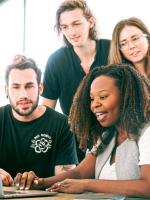 People smiling at computer