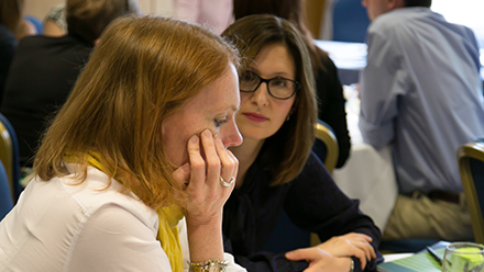 Two women in a conference workshop